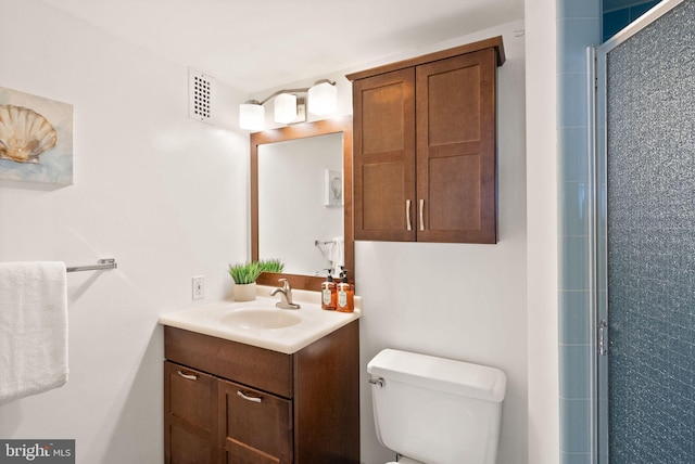 full bath featuring a stall shower, visible vents, vanity, and toilet