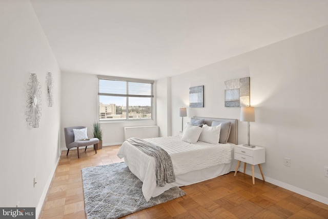 bedroom featuring baseboards