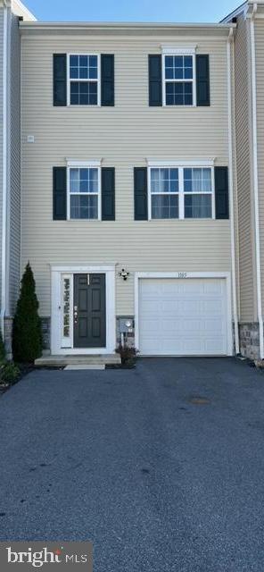 view of front of home featuring driveway and an attached garage