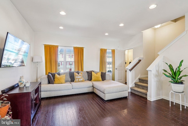 living room featuring dark wood-style floors, stairway, and recessed lighting