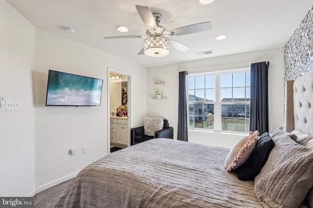 bedroom featuring ceiling fan, recessed lighting, visible vents, baseboards, and ensuite bath