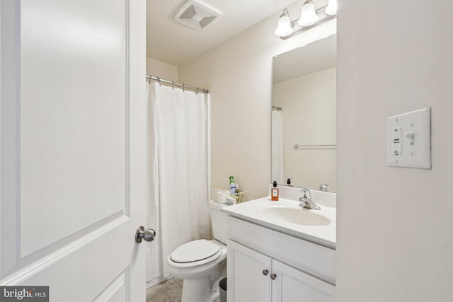 bathroom featuring toilet, vanity, and visible vents