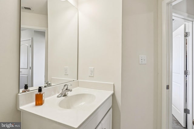 bathroom featuring visible vents and vanity