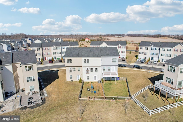 birds eye view of property with a residential view