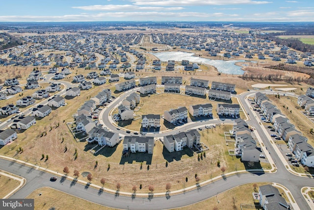 birds eye view of property with a residential view