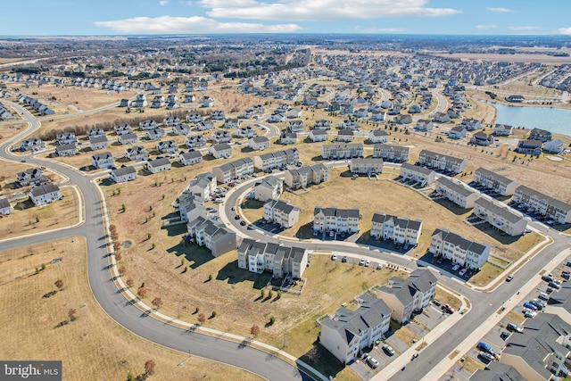 bird's eye view featuring a residential view and a water view