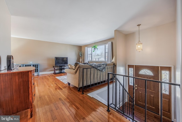 interior space featuring hardwood / wood-style flooring and baseboards