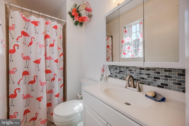 bathroom featuring curtained shower, backsplash, toilet, and vanity