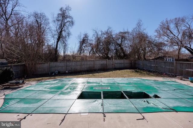 view of swimming pool featuring a fenced backyard