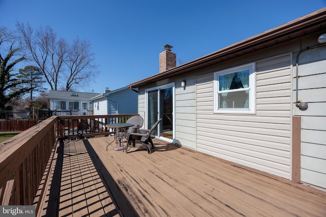 wooden deck featuring fence