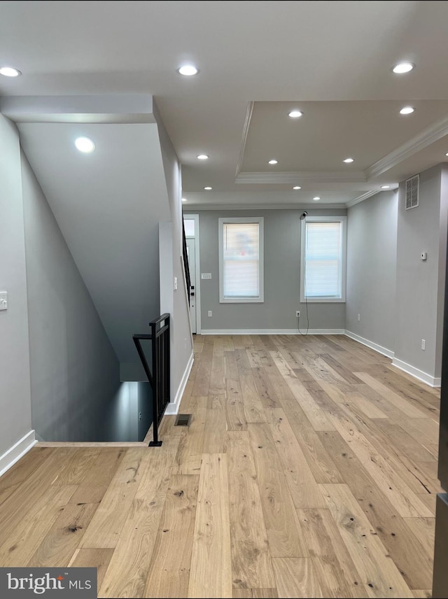 interior space featuring recessed lighting, visible vents, crown molding, and light wood-style flooring