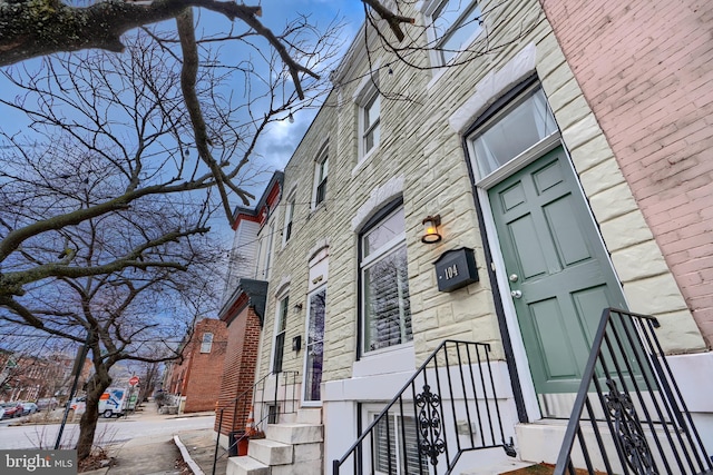 view of exterior entry with brick siding