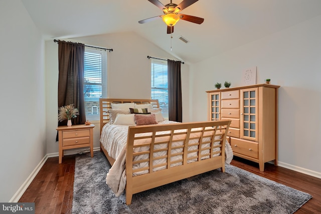 bedroom featuring lofted ceiling, wood finished floors, baseboards, and visible vents