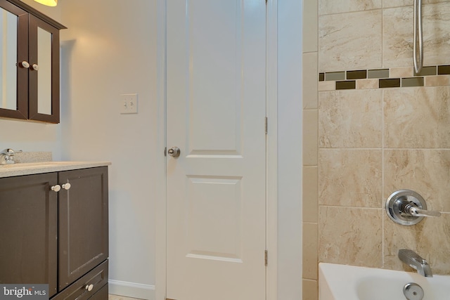 bathroom with vanity and shower / bathing tub combination