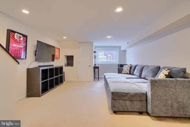 living area with recessed lighting, light colored carpet, and baseboards