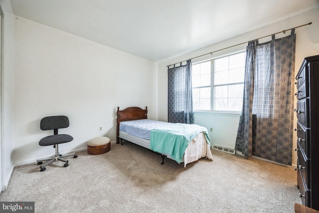 bedroom featuring visible vents and carpet floors