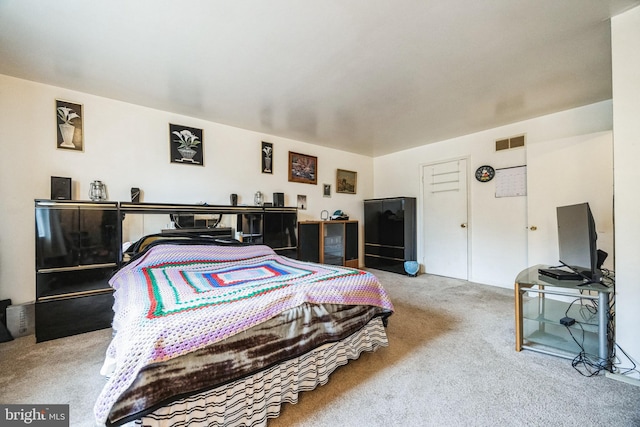 carpeted bedroom with visible vents