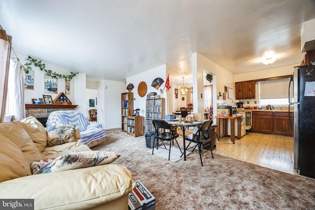 living room with light colored carpet and a healthy amount of sunlight