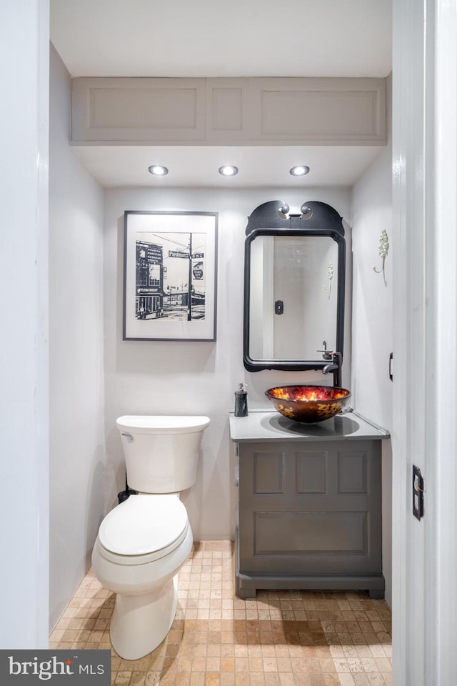 bathroom with toilet and vanity