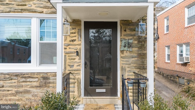 view of exterior entry with stone siding