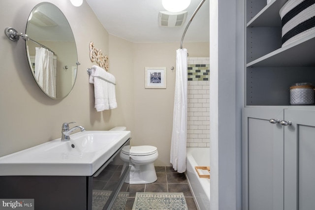 bathroom featuring visible vents, shower / bathtub combination with curtain, toilet, a sink, and tile patterned flooring