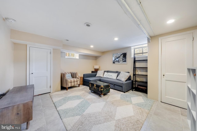 living area featuring light tile patterned flooring and recessed lighting