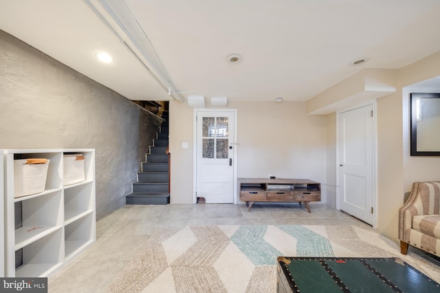 interior space featuring tile patterned floors and stairway