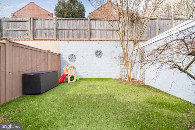 view of yard with a fenced backyard