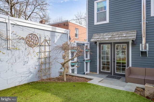 property entrance featuring french doors