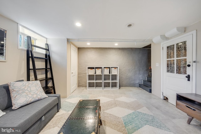 living room featuring stairs and recessed lighting