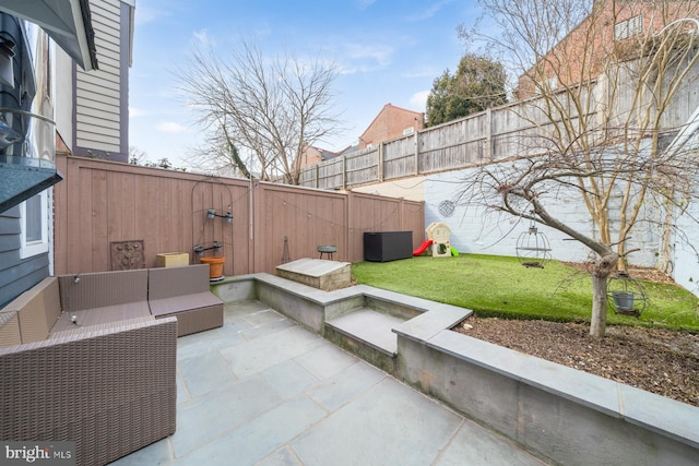 view of patio featuring an outdoor hangout area and a fenced backyard