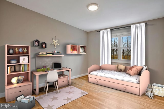 home office with baseboards and wood finished floors