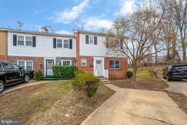 view of property featuring brick siding