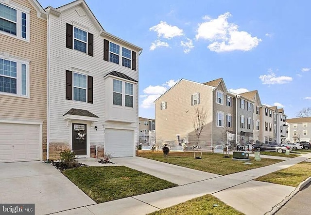 multi unit property with concrete driveway, an attached garage, a residential view, and a front yard