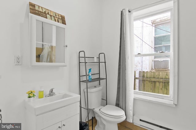 3823 Poplar St, Philadelphia, PA 19104 - full bathroom with a baseboard heating unit, a shower with shower curtain, toilet, and vanity