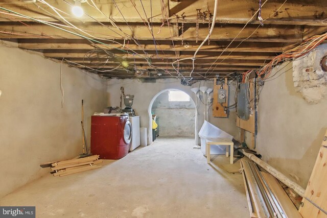 3823 Poplar St, Philadelphia, PA 19104 - below grade area with electric panel, arched walkways, and washing machine and clothes dryer