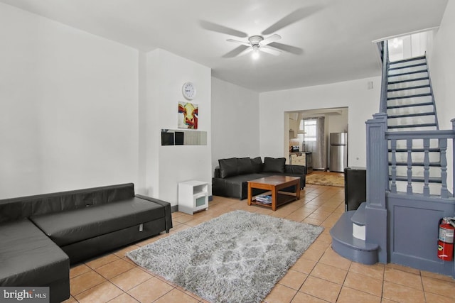 3823 Poplar St, Philadelphia, PA 19104 - tiled living room with stairs and ceiling fan
