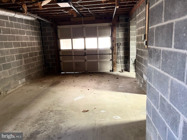 garage with concrete block wall