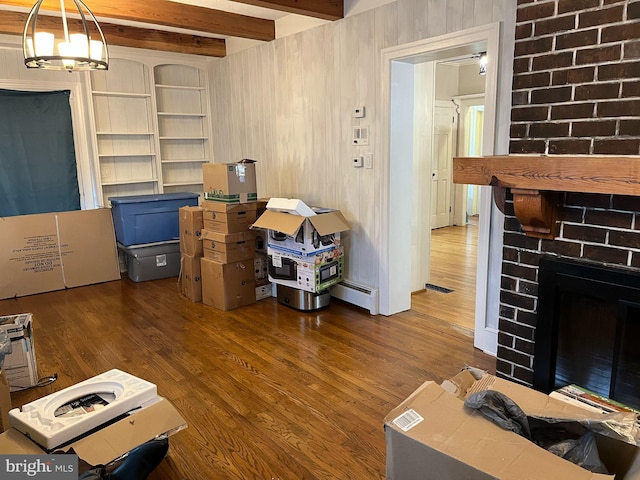 interior space featuring visible vents and a baseboard heating unit