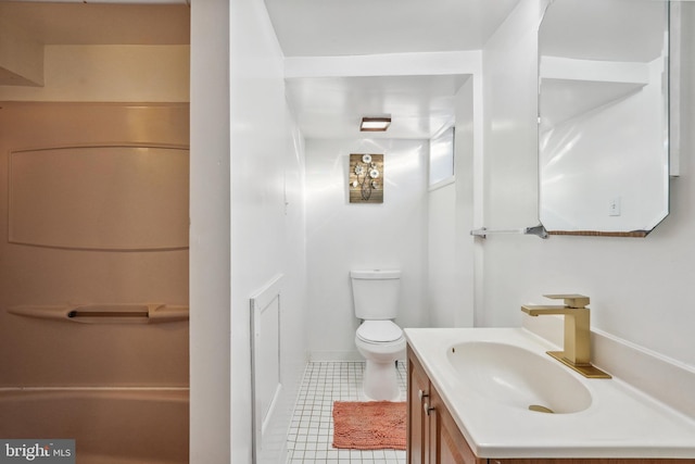 bathroom with vanity, toilet, and tile patterned flooring