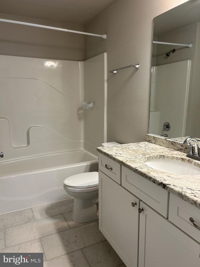 bathroom with toilet, bathtub / shower combination, and vanity