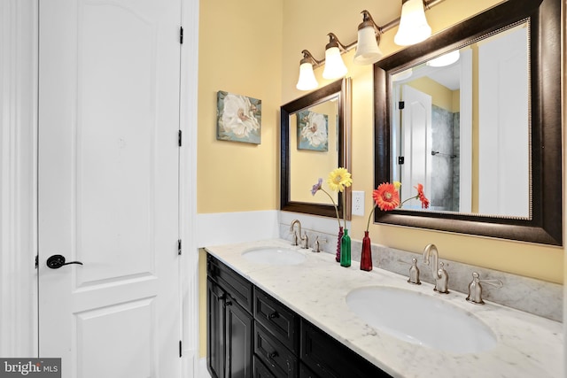 full bathroom with a sink and double vanity