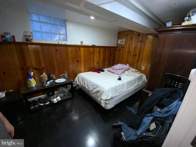 3227 Woodring Ave, Baltimore, MD 21234 - bedroom with wood finished floors and wooden walls