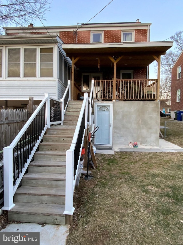 3227 Woodring Ave, Baltimore, MD 21234 - view of front of house featuring brick siding, fence, and stairway