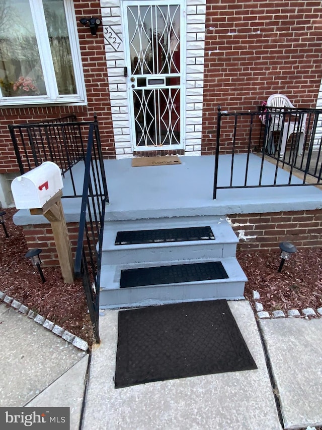 3227 Woodring Ave, Baltimore, MD 21234 - property entrance with brick siding