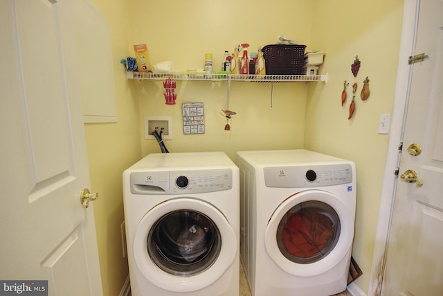 washroom with washer and dryer and laundry area