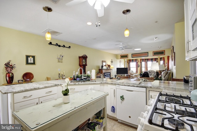 kitchen with decorative light fixtures, open floor plan, white cabinetry, ceiling fan, and white appliances