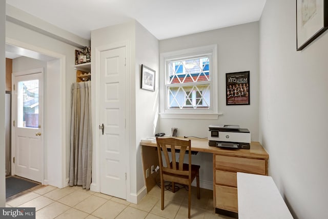 office area with light tile patterned floors and plenty of natural light