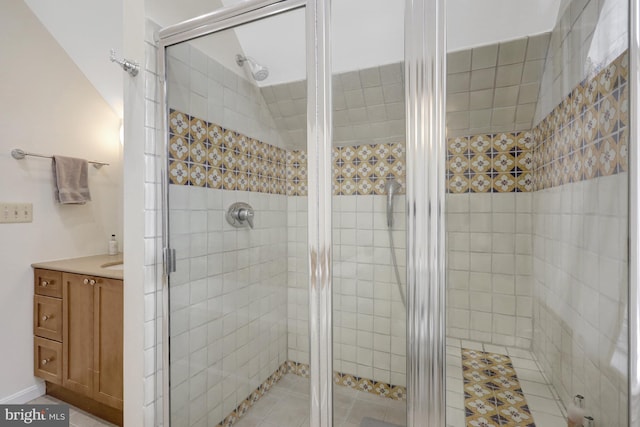 full bathroom with vanity and a shower stall