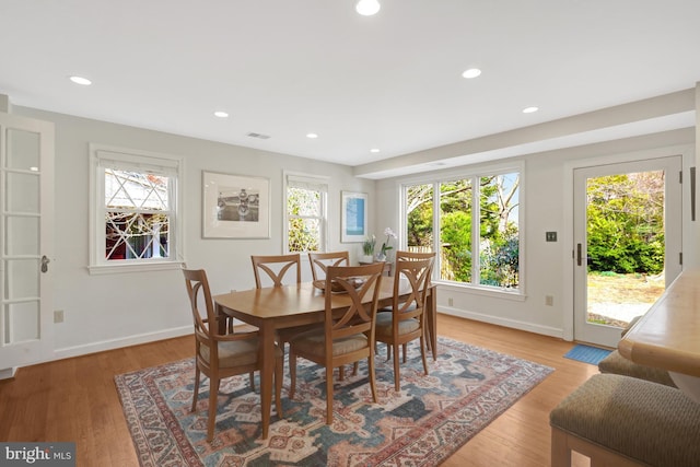 dining space featuring recessed lighting, light wood-type flooring, and baseboards